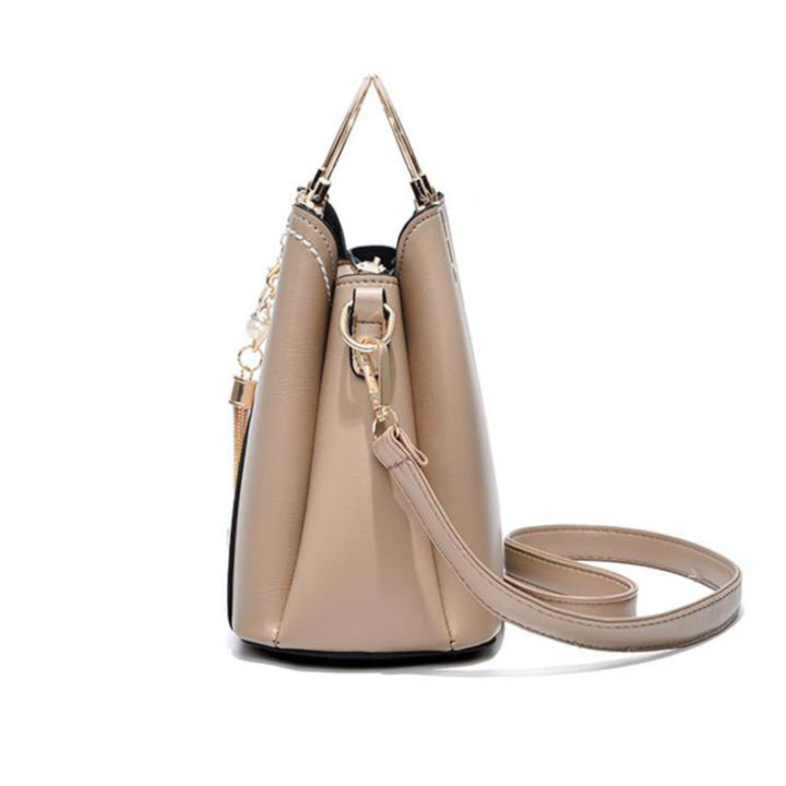 Color block handbag with heart tassel
