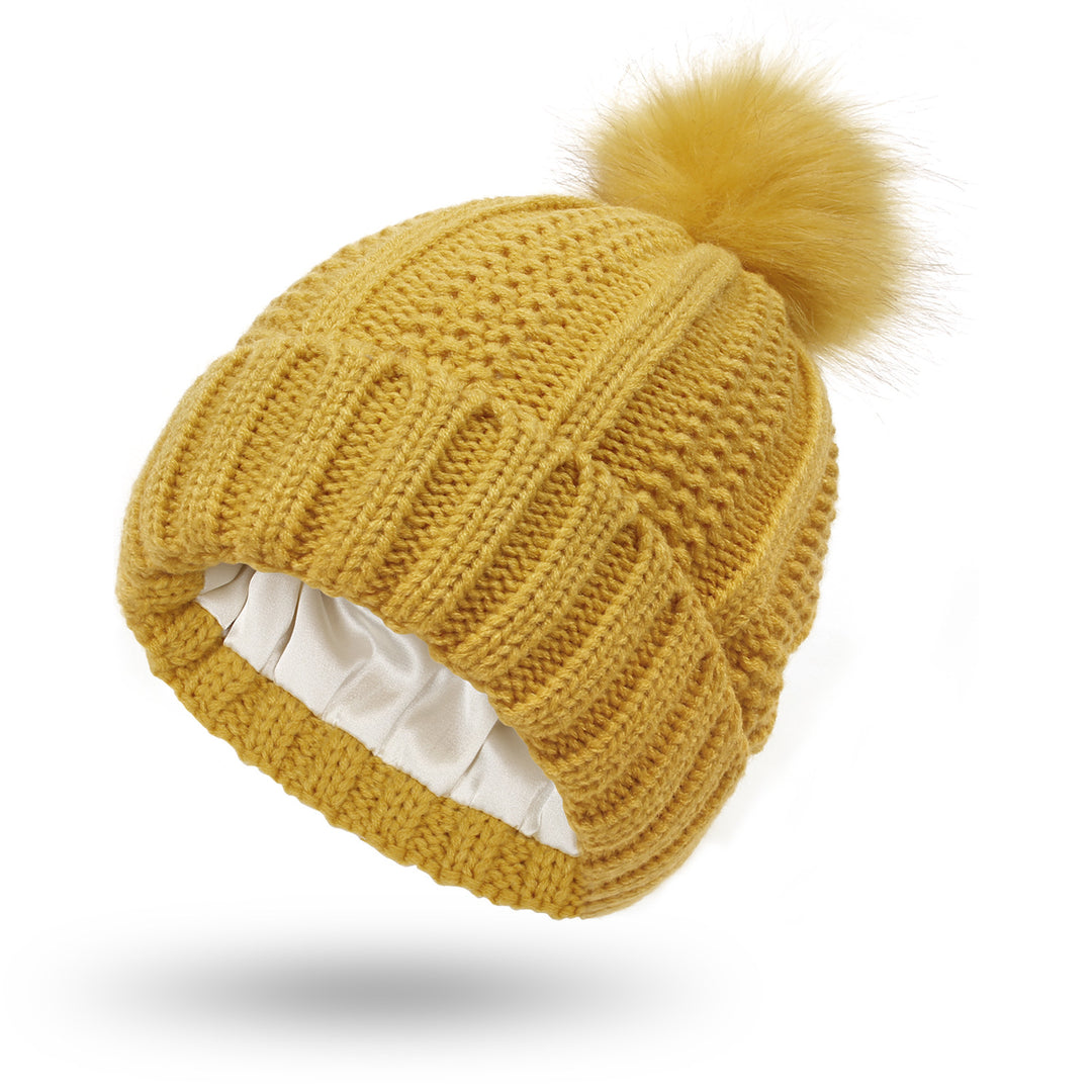 Knit beanie with faux fur pom pom
